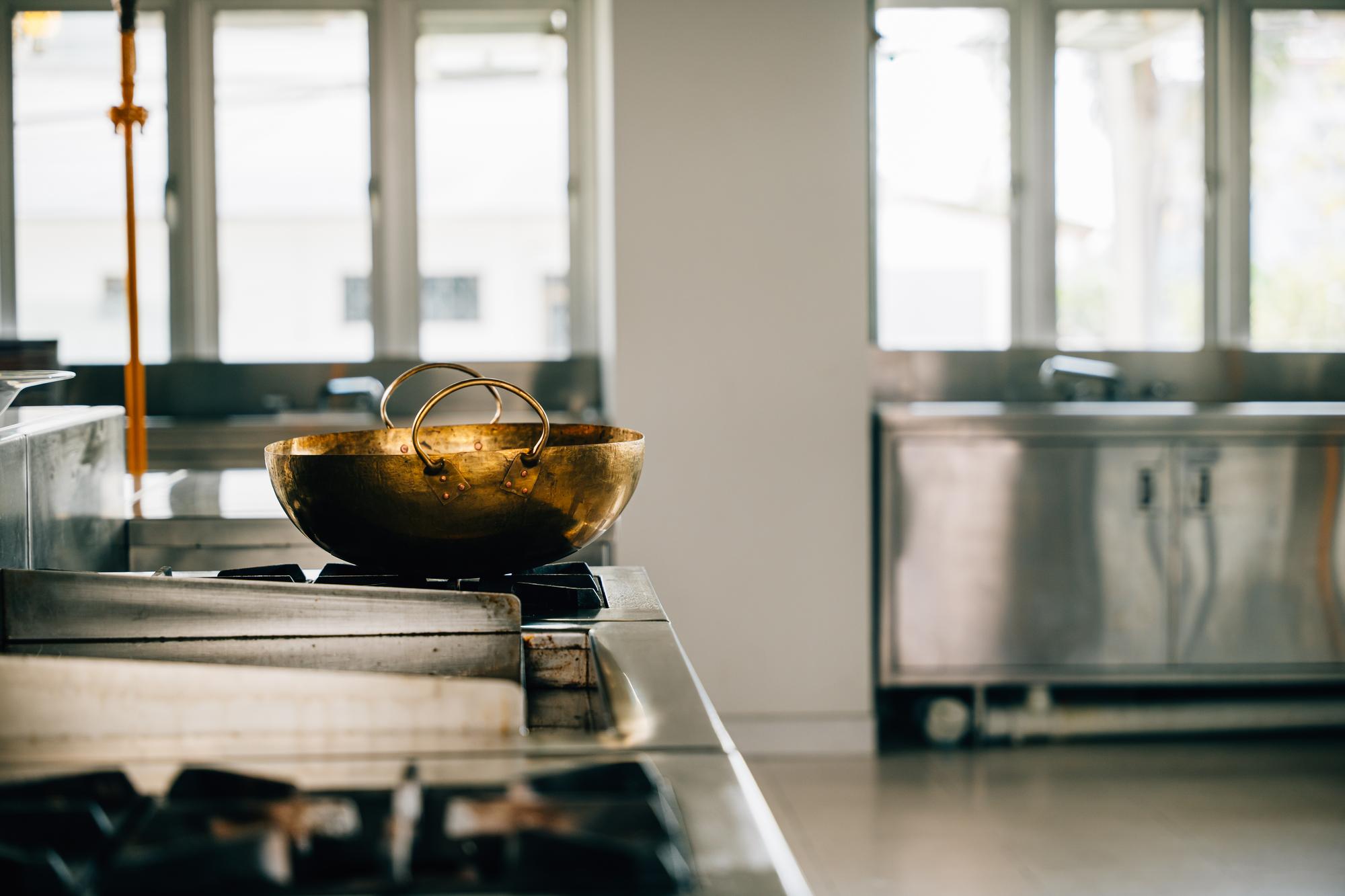 Interior of a compact culinary atelier with stainless surfaces